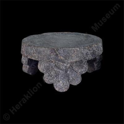 Stone offering table with rosette legs