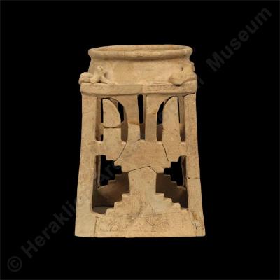 Clay four-sided stand with religious symbols