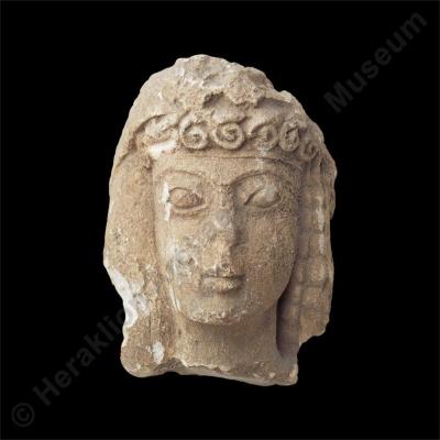Stone head of young woman