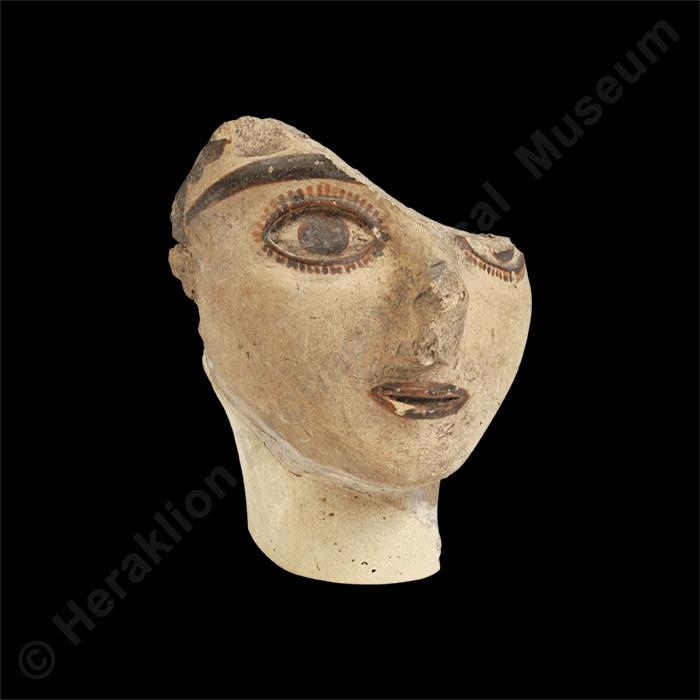 Clay head of female figurine