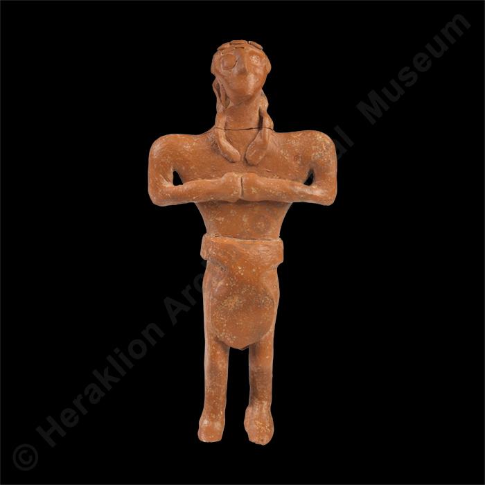 Male figurine in loincloth, hands joined at chest height