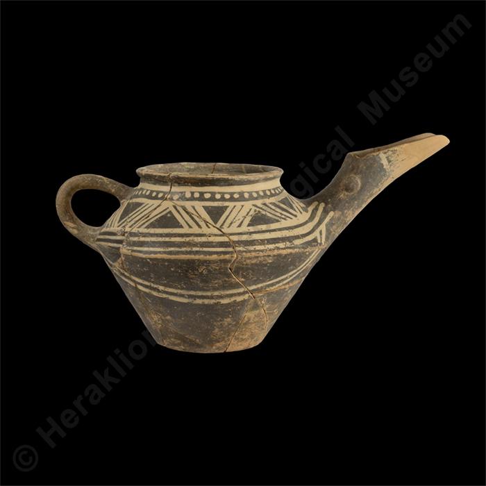 Clay beaked jug with white linear decoration