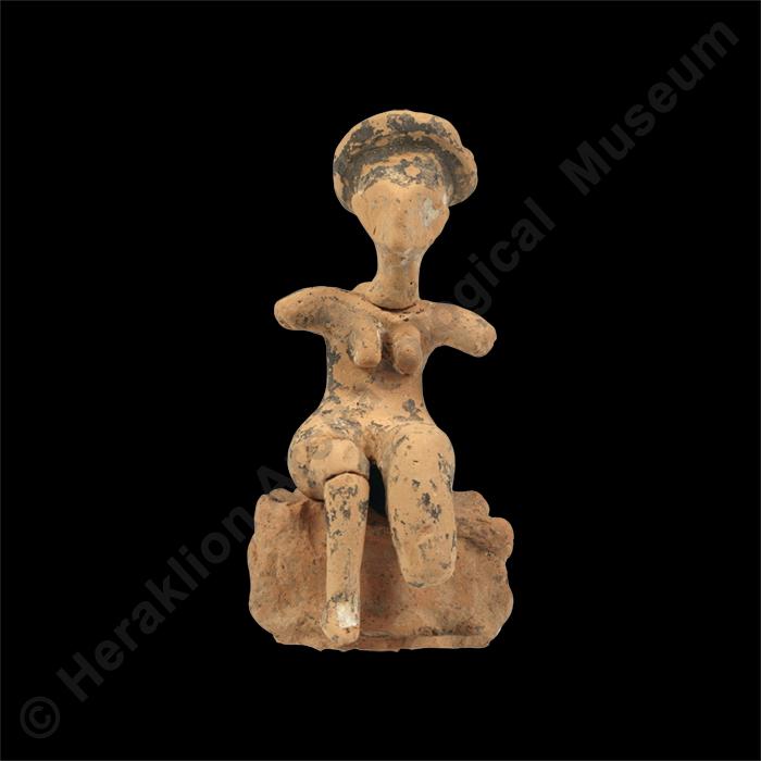 Seated female figurine