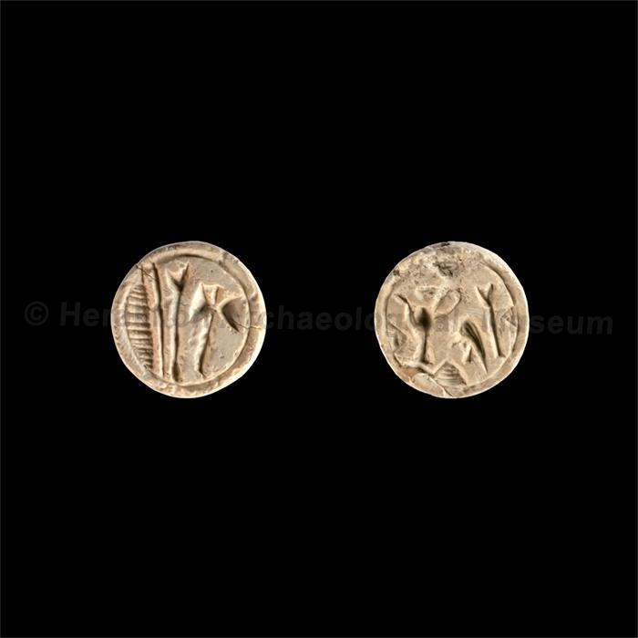 Discoid seal of hippopotamus ivory with symbols of early Hieroglyphic script