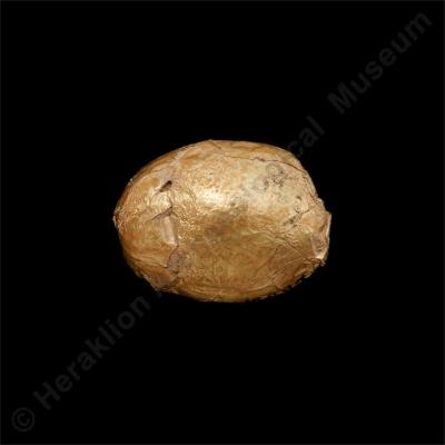 Lentoid stone with gold leaf