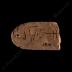 Long clay tablet with rounded ends with Linear A inscription