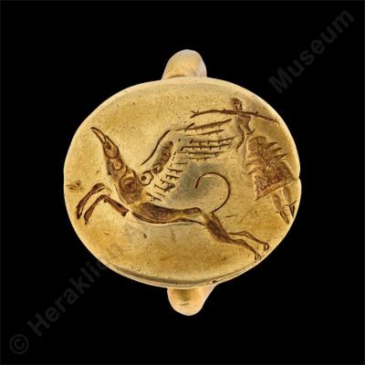 Gold signet ring with griffin and floating goddess with extended arms