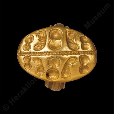 Gold signet ring with figure-of-eight shields and sacral knots