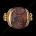 Gold-mounted sard sealstone/pendant with religious symbols